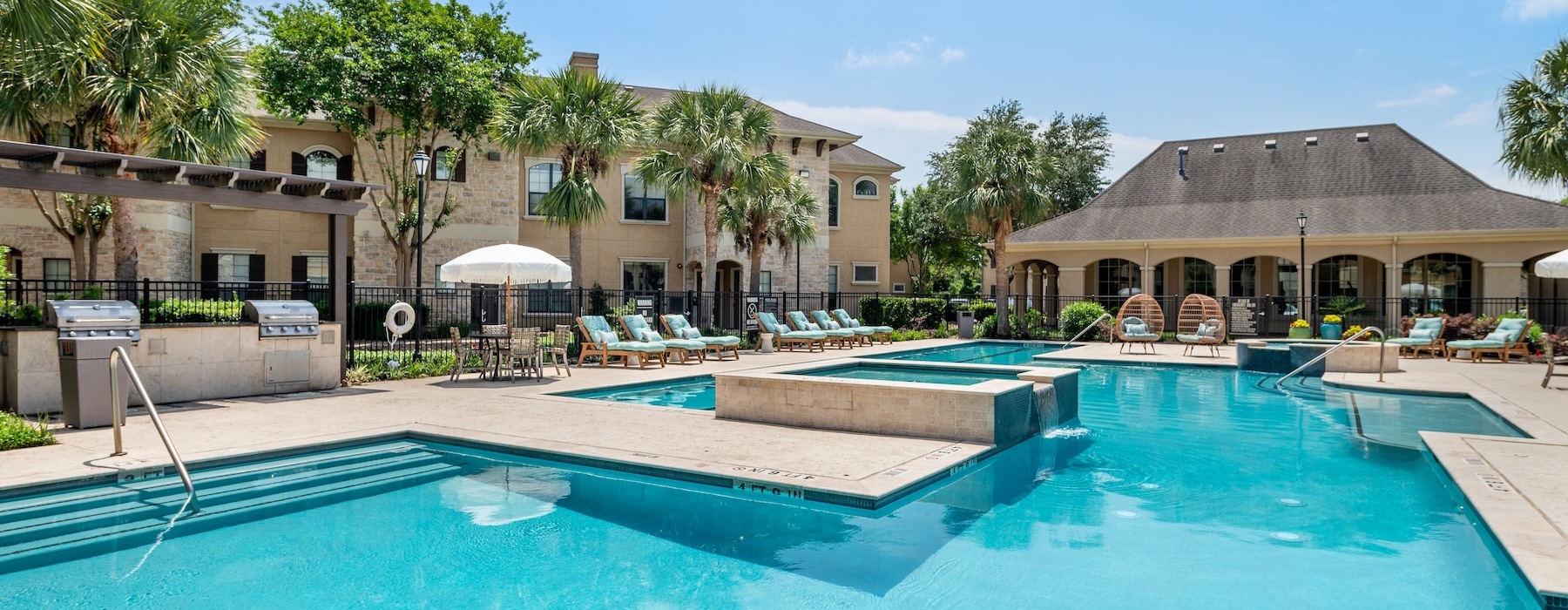 a pool with a building in the background