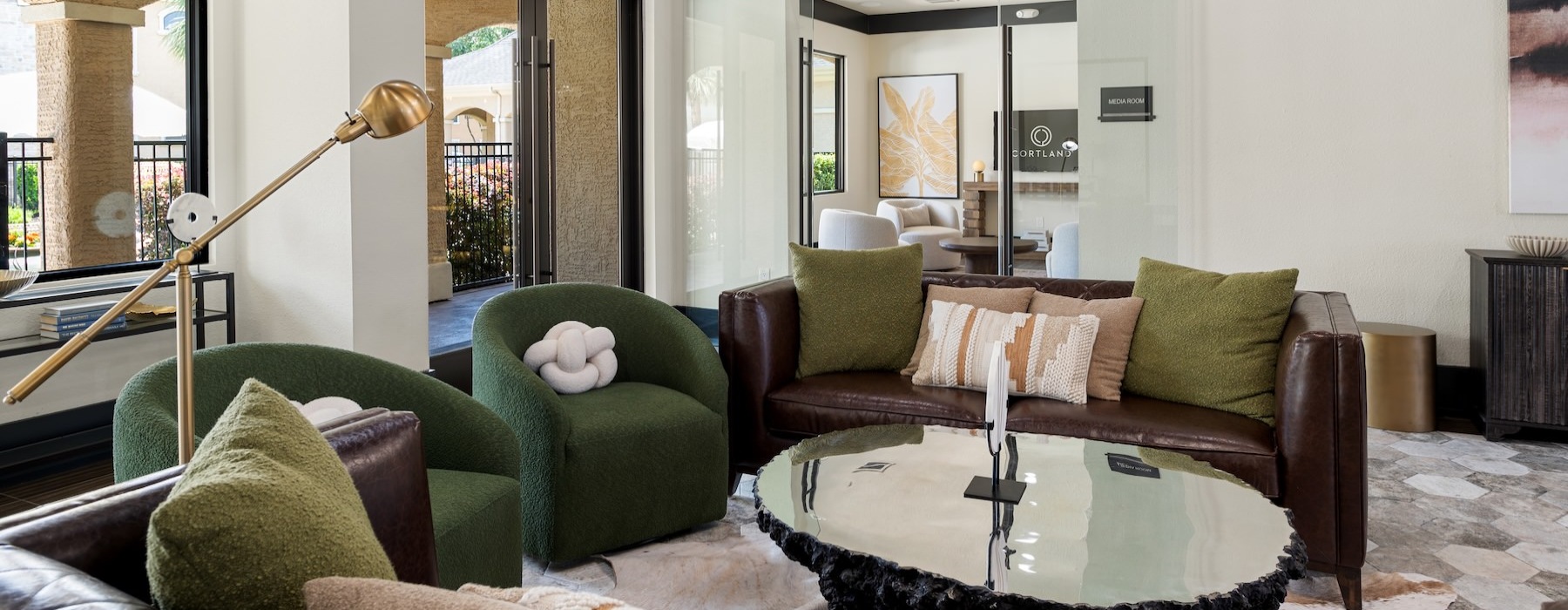 a lounge with green couches